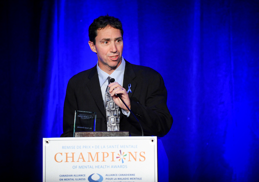 Scott Chisholm accepts' Champion of Mental Health' Award